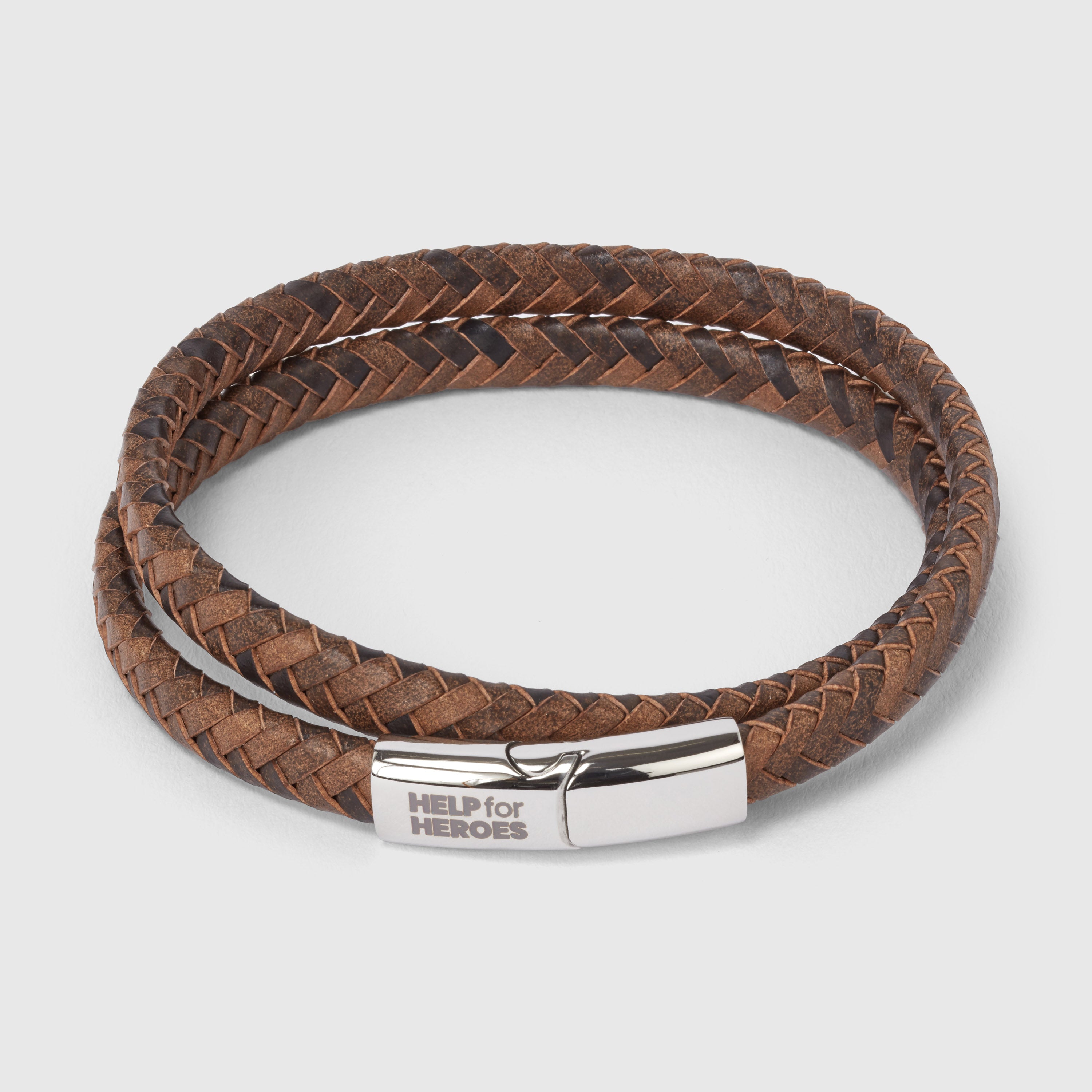 A brown double wrap leather bracelet with a metal clasp depicting the Help for Heroes logo