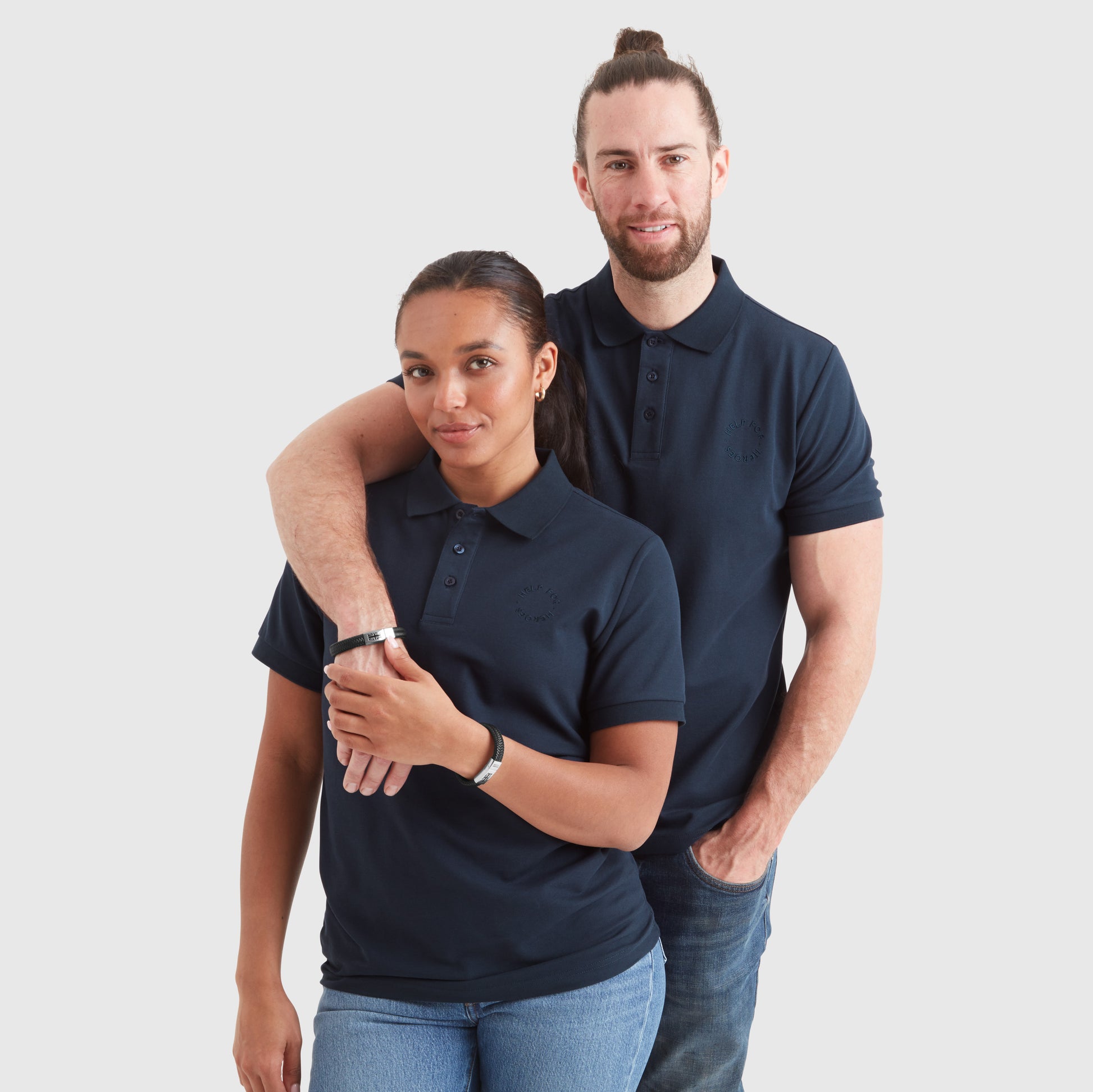 Models wearing black leather chunky bracelets with a clasp featuring the Union Jack flag and the 'Help for Heroes' logo.