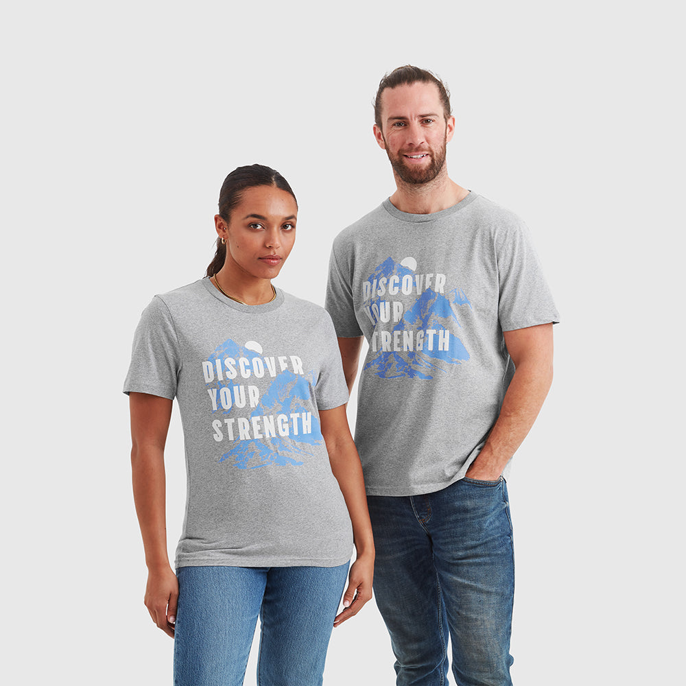 Two models wearing grey Help for Heroes tshirts featuring discover your strength slogan and mountain print design