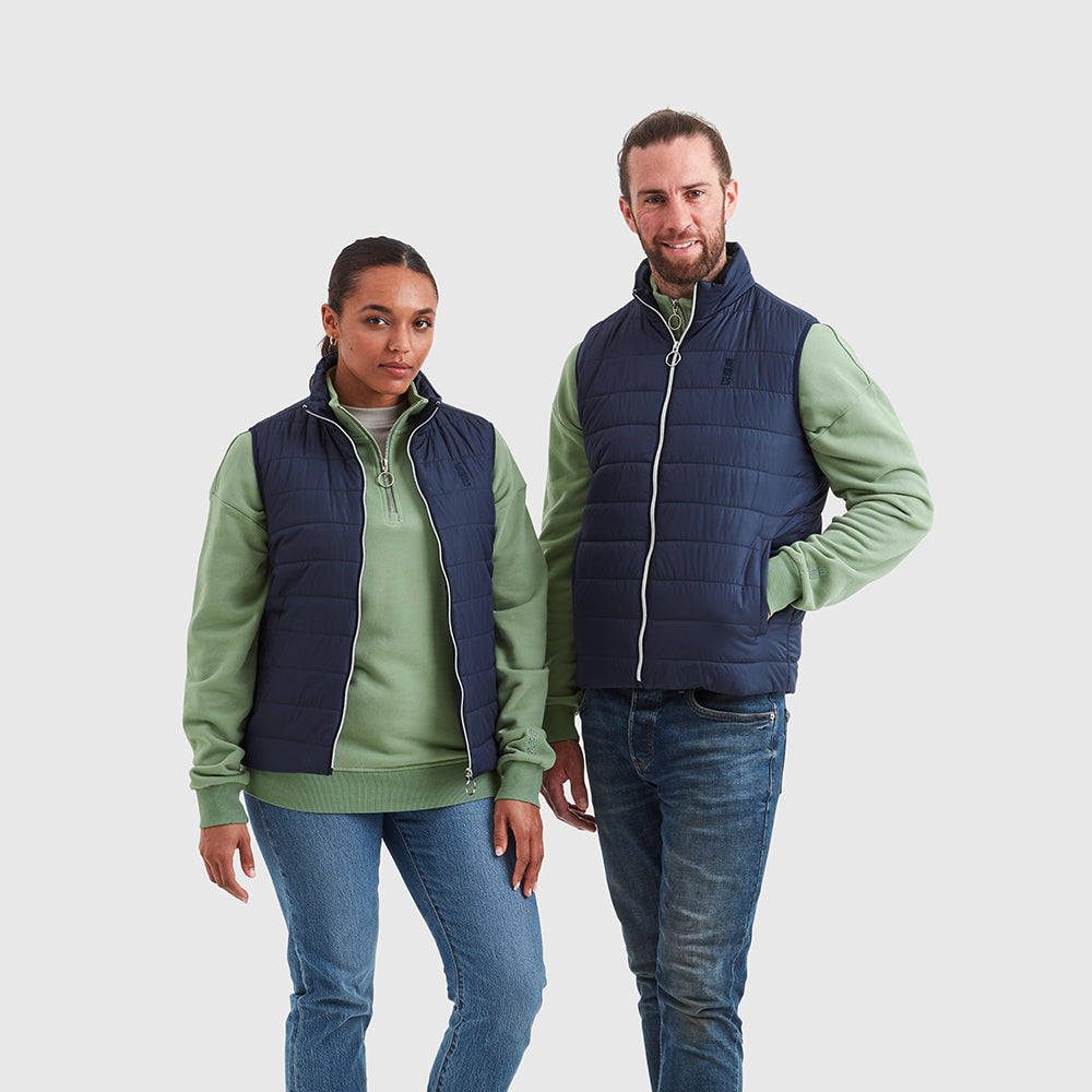 Two models wearing navy padded gilets, featuring metal zip and embroidered Help for Heroes logo on the chest