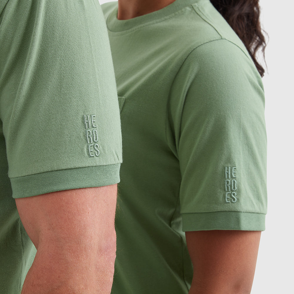 Two models wearing washed green t-shirts with a chest pocket and a subtle Help for Heroes embroidered logo on the sleeve