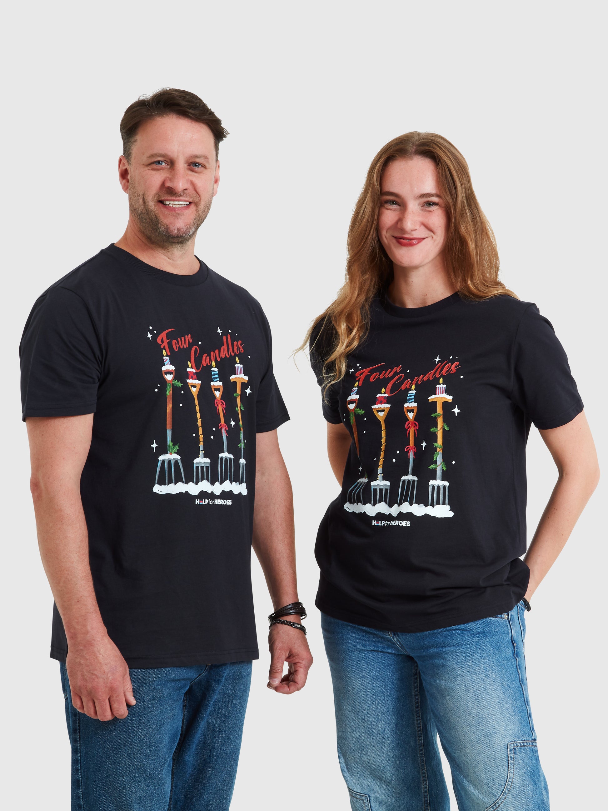 Two models wearing navy Help for Heroes Christmas tshirts, featuring the Four Candles graphic print