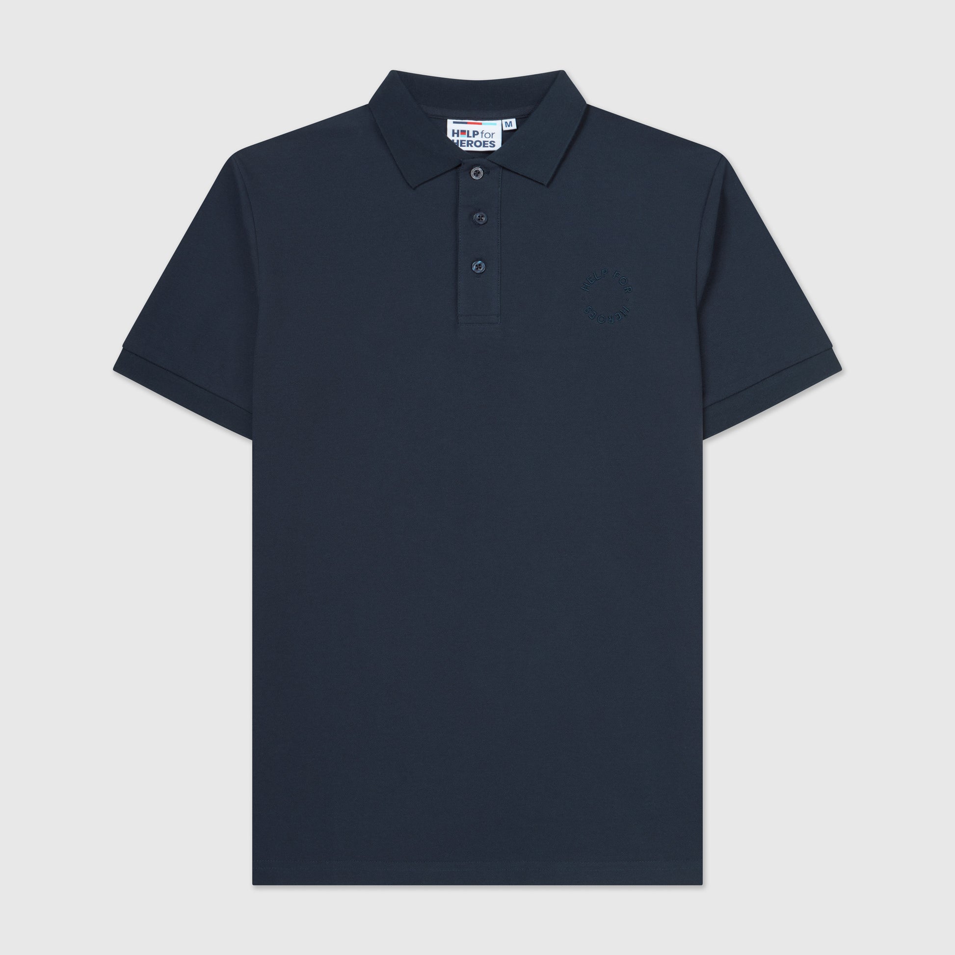 Front image of navy pique polo shirt with a subtle circular Help for Heroes logo on the chest and a rubber Heroes stack patch at the back neck.