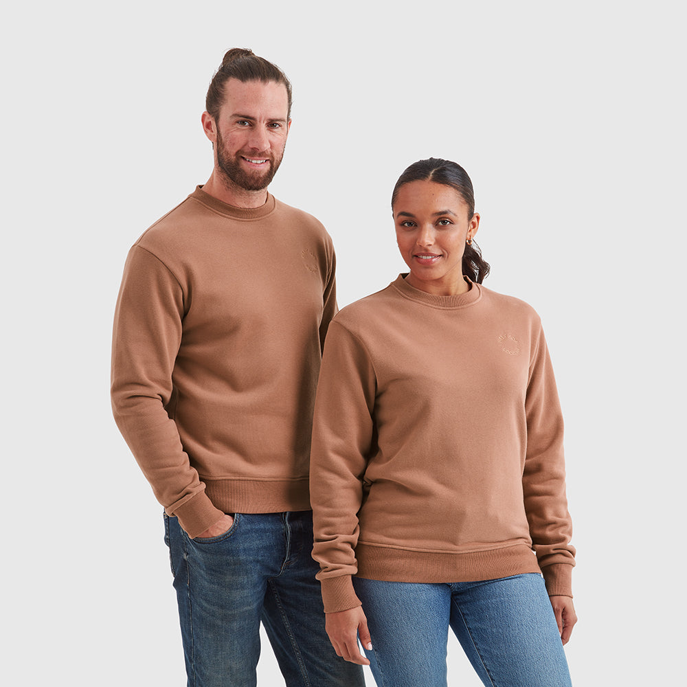Two models wearing crew neck Help for Heroes sweatshirts in mocha, featuring an embroidered circular Help for Heroes logo on the chest and a rubber Heroes rubber logo on the back neck