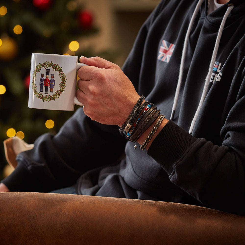 White Christmas mug with Help for Heroes Military figures inside a wreath