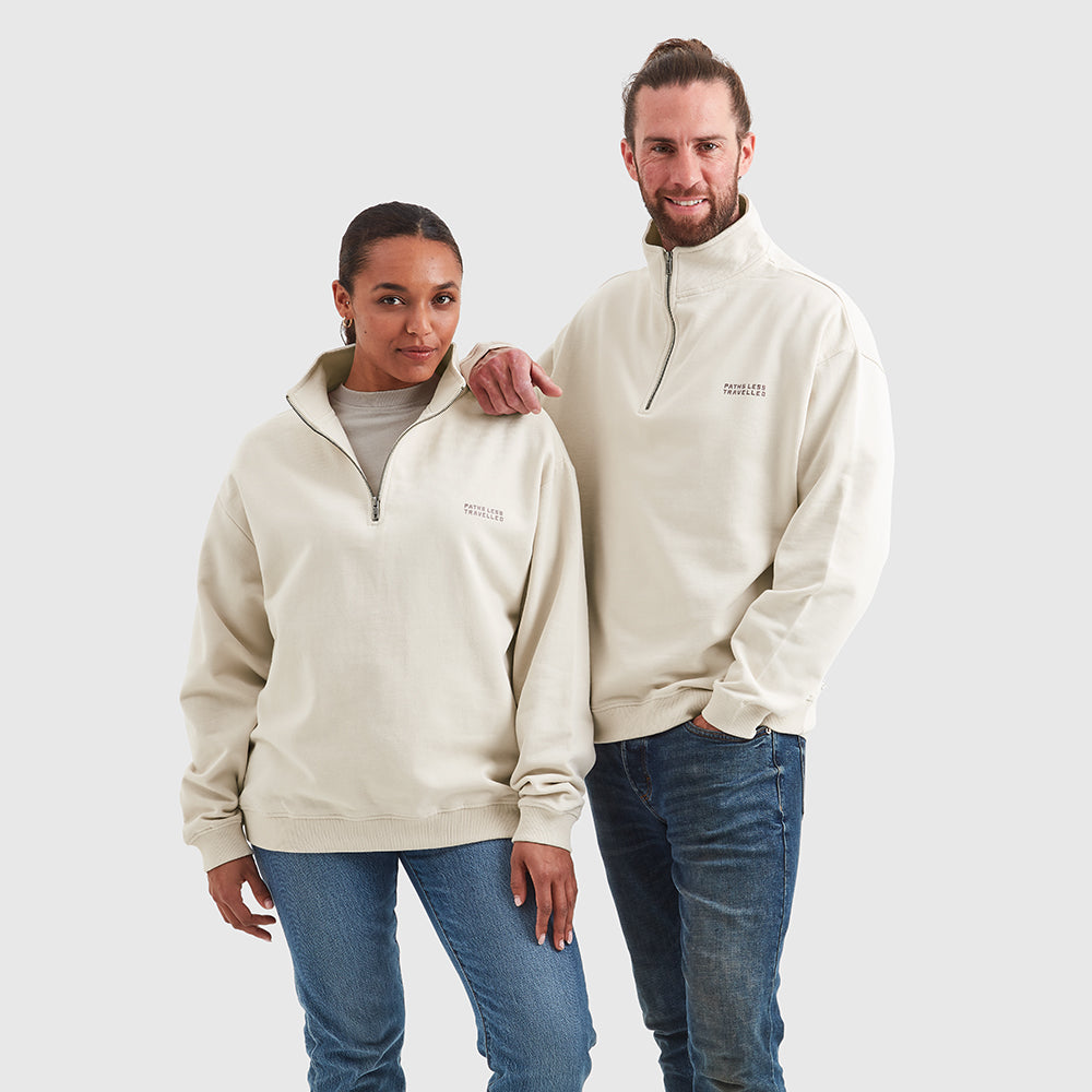 Two models wearing Help for Heroes quarter zipped sweatshirt in oat, featuring paths less travelled logo printed on the chest