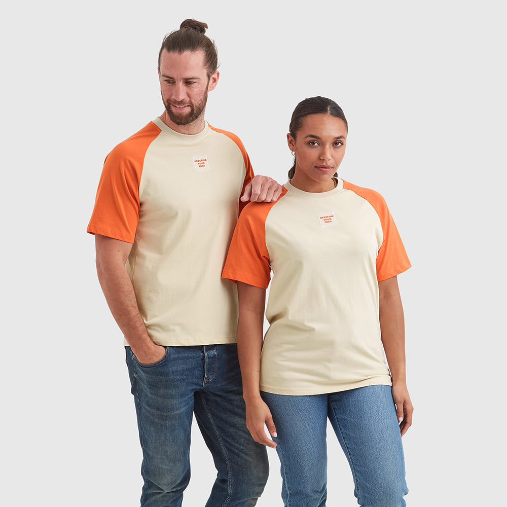 Two models wearing Help for Heroes crew neck beige t-shirts with contrasting orange sleeves. Featuring a chest patch with "redefine your path" text