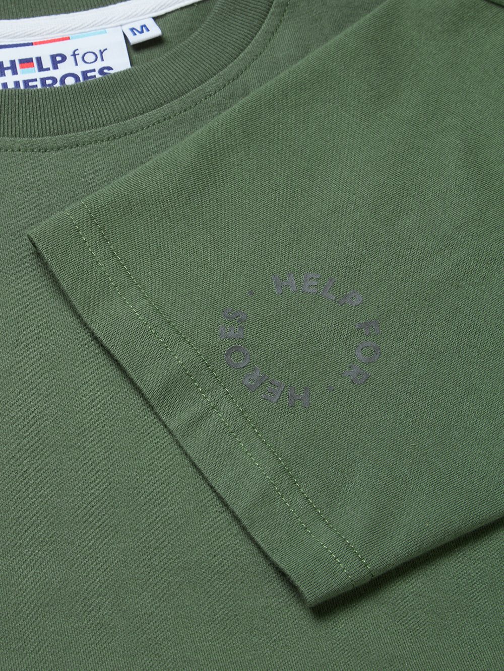 Close up sleeve detail of a circular Help for Heroes logo on a Khaki t-shirt