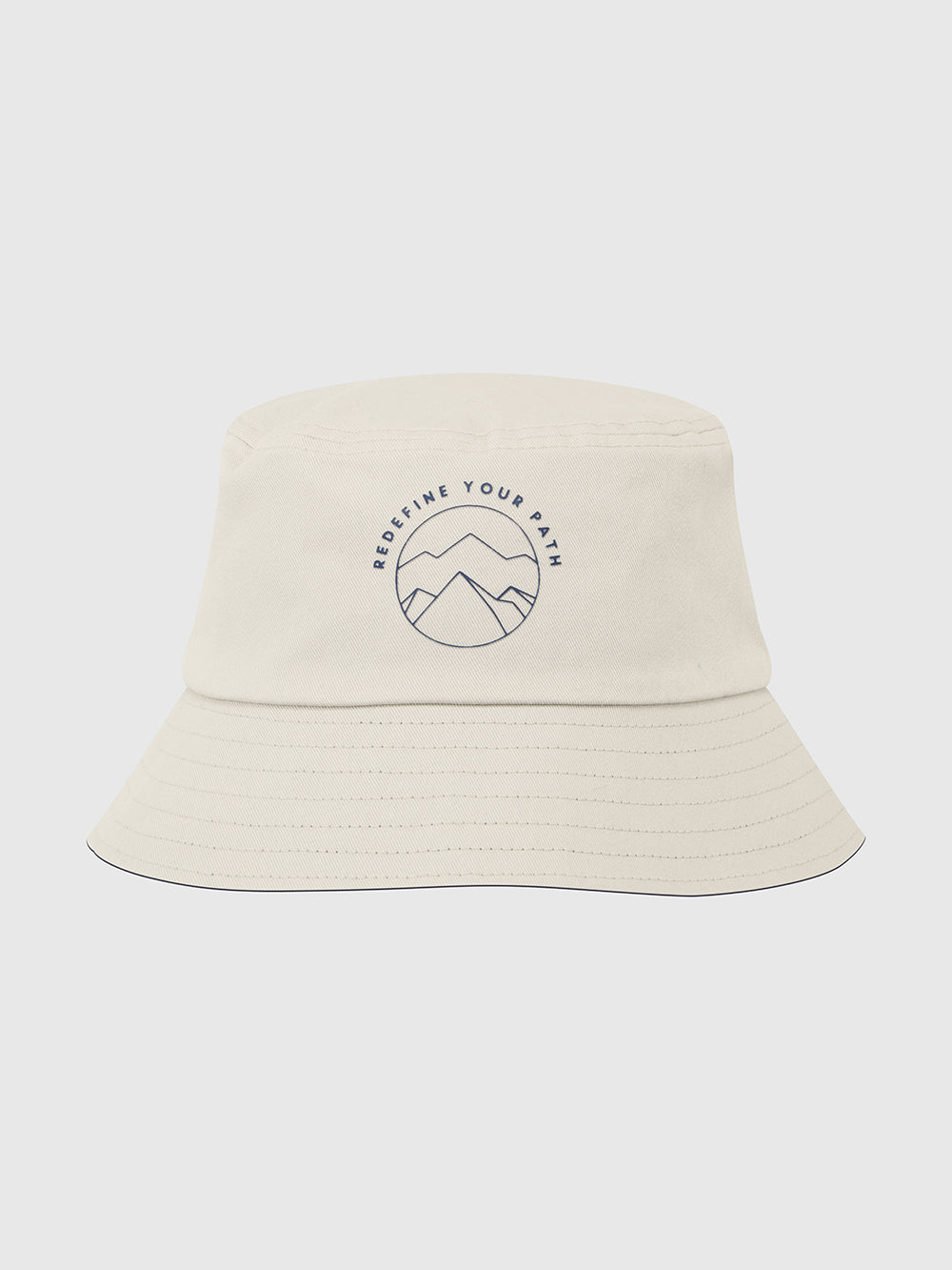 Help for Heroes reversable bucket hat. Image shows oat side which features a mountain logo and redefine your path printed text