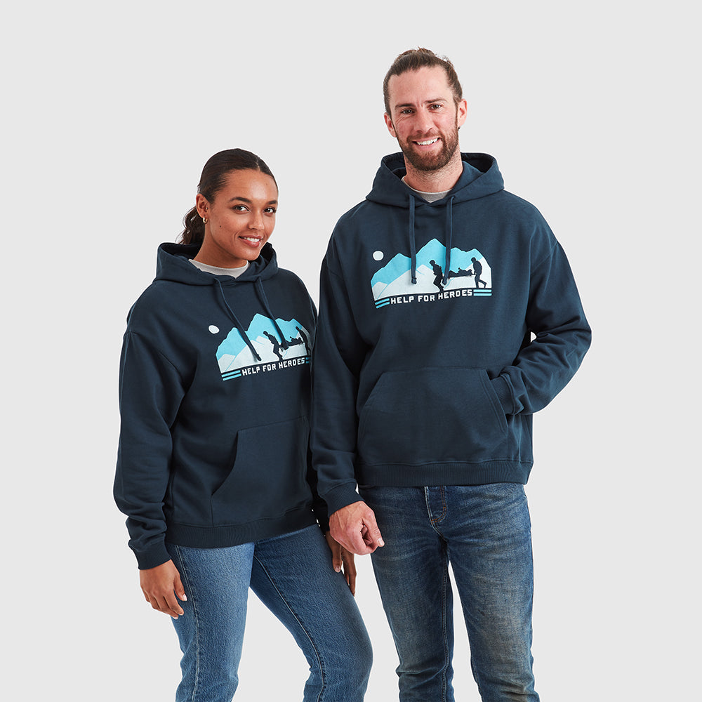 Two models wearing navy pullover Help for Heroes hoodies, featuring the stretcher bearer logo