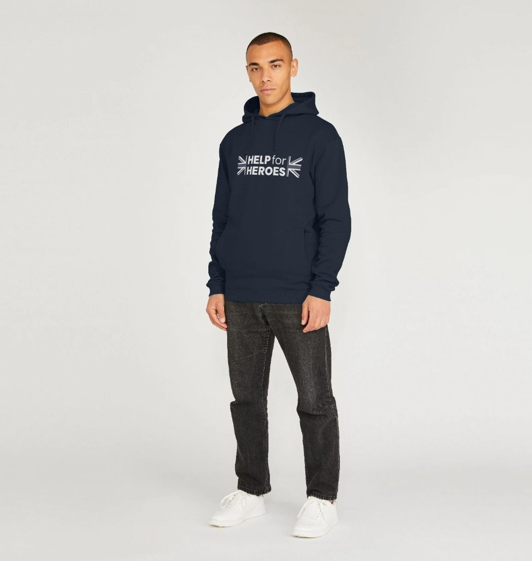 Model wearing a navy pullover hoody with the Help for Heroes logo printed between the Union Jack flag