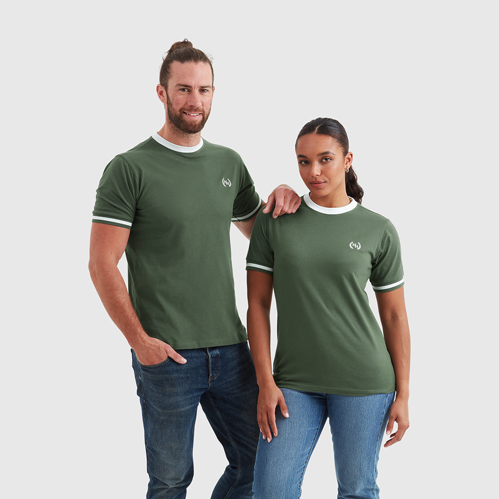 Two models wearing khaki green crew neck t-shirts with white contrast detailing and a small embroidered Help for Heroes wreath logo on the chest