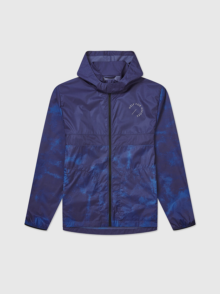 Front image of blue cagoule sports jacket, featuring a hood and printed help for heroes logo on the chest