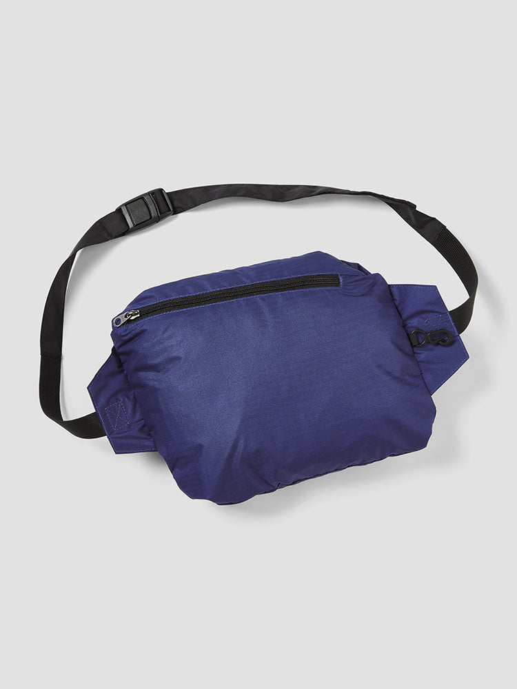Image of the blue help for heroes sports jacket folded in a pouch