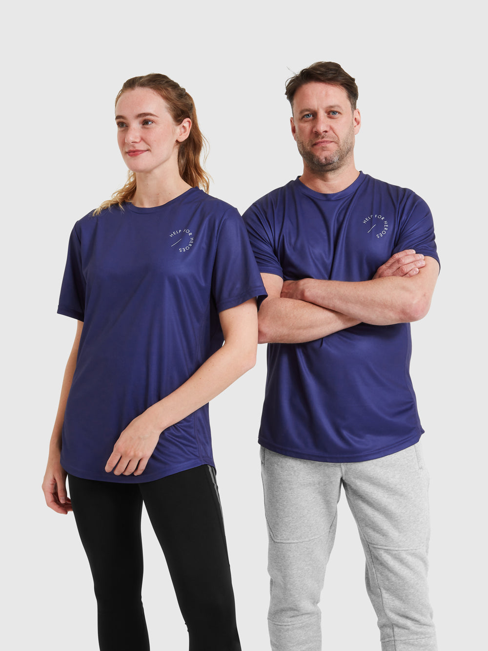 Models wearing blue sports tops featuring the help for heroes logo printed on the chest