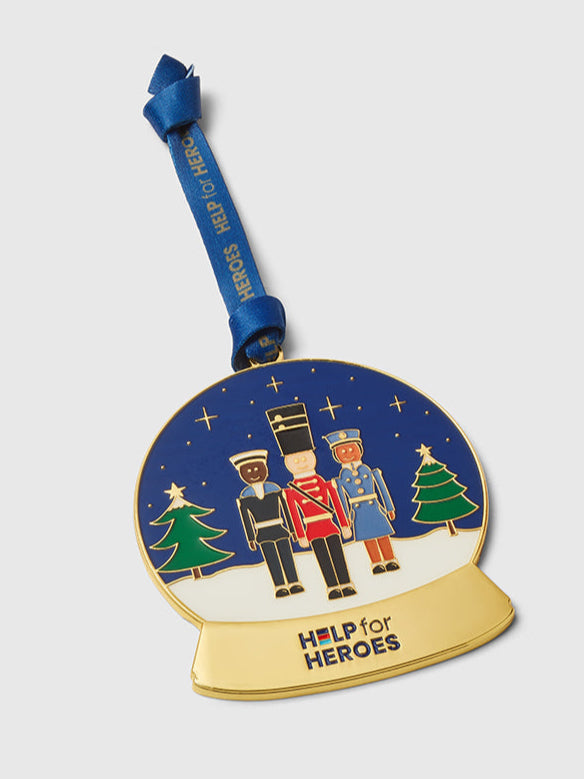 Help for Heroes enamel snow globe Xmas decoration. Featuring three military figures on a branded blue ribbon