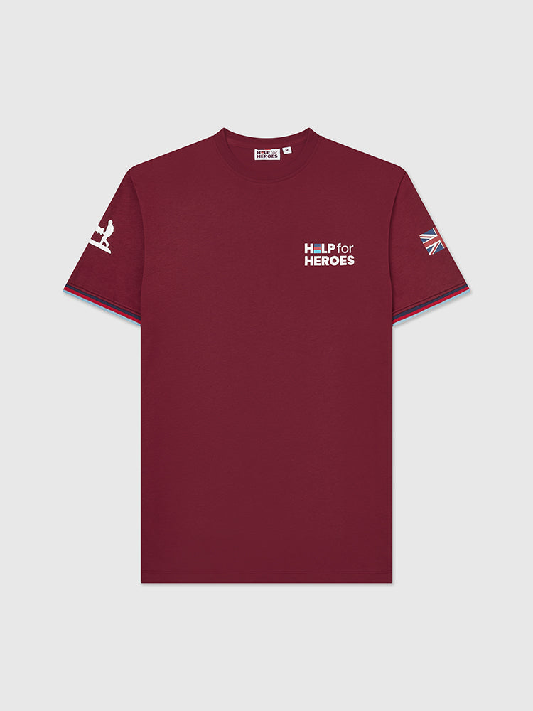 Front image of burgundy shirt with Help for Heroes logo printed on chest. Also features stretcher bearer logo and Union Jack flag on sleeves. Tri colour tipped sleeves.
