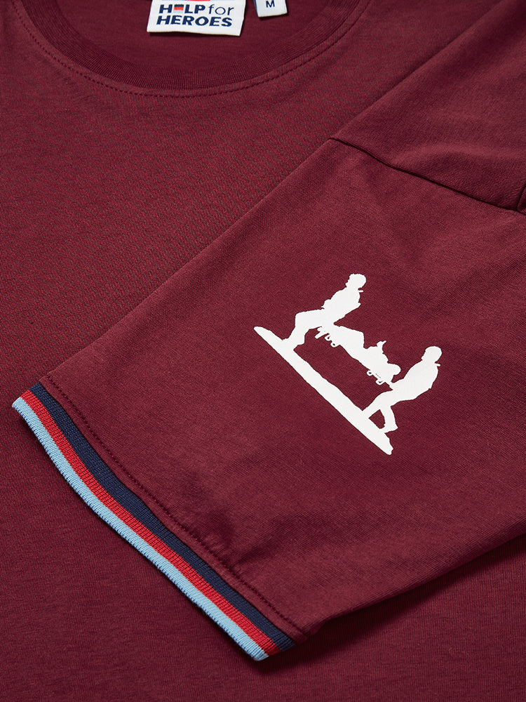Close up image of stretcher bearer logo and tri colour tipped sleeves on Help for Heroes burgundy tshirt